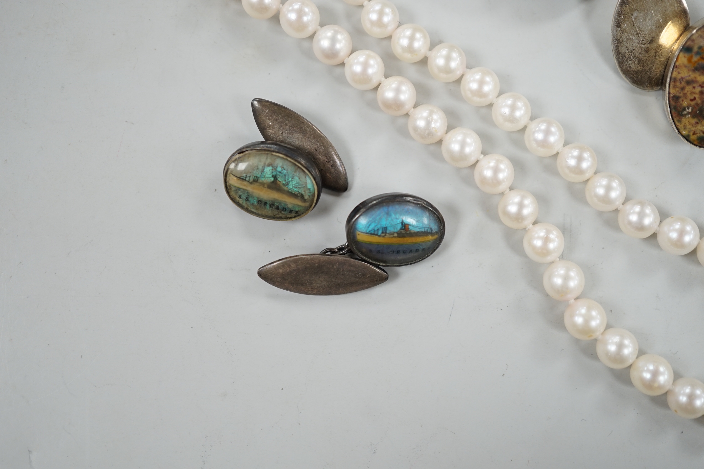 A modern pair of silver and hardstone set oval cufflinks, one other pair decorated with the 'S.S. Orcades' and a cultured pearl necklace.